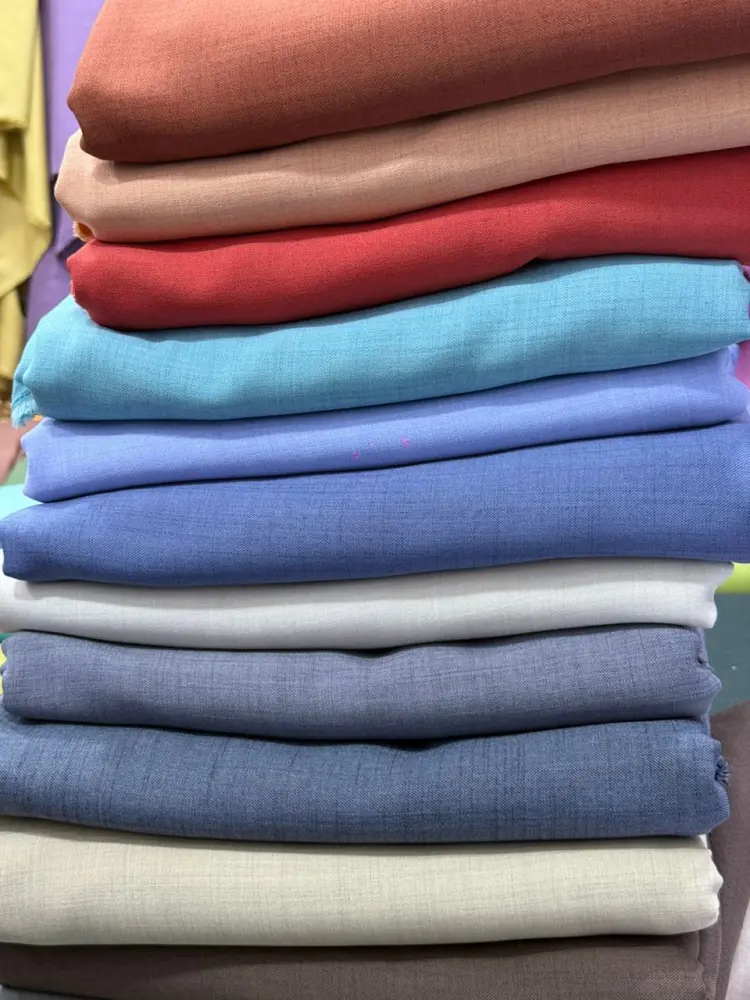 Stacks of colorful Cotton fabrics 4 yards each.