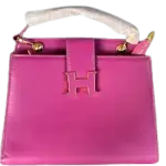 Hermès Constance Bag Trapezoidal shape, a prominent "H" clasp on the front, and a Single Top Handle with distinctive gold-tone hardware.