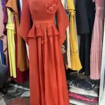 Long Sleeved Maxi Dress with a Peplum Waist and Floral Applique detail on the shoulder.(Free Size)