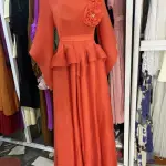Long Sleeved Maxi Dress with a Peplum Waist and Floral Applique detail on the shoulder.(Free Size)