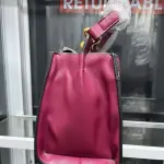 Hermès Constance Bag Trapezoidal shape, a prominent "H" clasp on the front, and a Single Top Handle with distinctive gold-tone hardware.