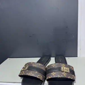 Louis Vuitton Lock It Flat Mules 'Lock It'