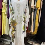 White Kaftan Dress featuring Colorful, Nature-inspired Embroidery.