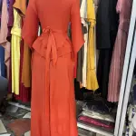 Long Sleeved Maxi Dress with a Peplum Waist and Floral Applique detail on the shoulder.(Free Size)