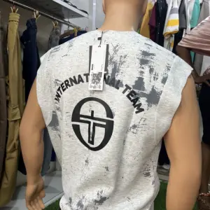 Vintage-style Sleeveless Tank with a Heavy focus on "Streetwear-distressed" Aesthetics.