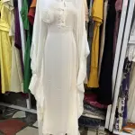 Elegant White Maxi Dress or Abaya with long, flowing sleeves and a full-length Silhouette.