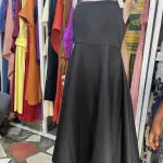 Elegant two-piece set consisting of a cinched-waist peplum jacket and a matching long dress