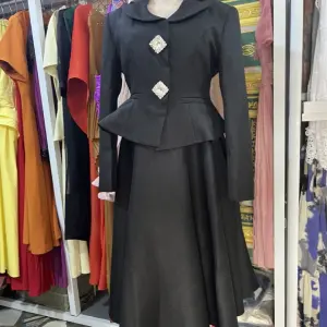 Elegant two-piece set consisting of a cinched-waist peplum jacket and a matching long dress