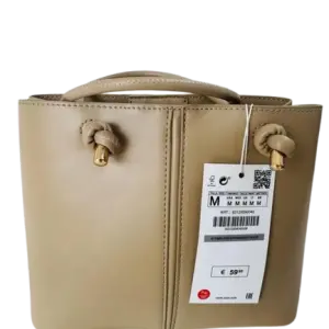ZARA Mini City Bag with decorative knot details on the handles.