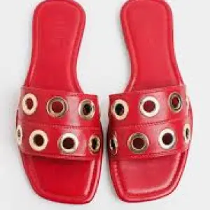 Berness Red Patent Grommet Slide Sandals.