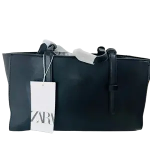 Zara Tote in Black is a sophisticated Handbag featuring Multiple storage areas for organization.