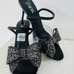 Zara Bow High Heel Sandals in a diamante-encrusted bow on the instep and a side buckle.