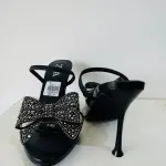 Zara Bow High Heel Sandals in a diamante-encrusted bow on the instep and a side buckle.