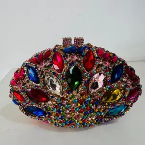 Gemstone-Encrusted Evening Clutch, with a multicolor Mosaic of Large Rhinestones and Crystals in various cuts like oval, teardrop, and marquise.