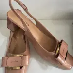 Nude patent leather slingback pumps, in a square toe and block heel, similar to Aaron Fairy