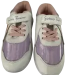 White and purple children's sneakers feature pink laces and hook-and-loop straps labeled "Sisters Forever