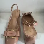 Nude patent leather slingback pumps, in a square toe and block heel, similar to Aaron Fairy