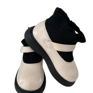 Black and cream chunky-soled Mary Jane flats in a contrast design with a strap and thick platform sole.