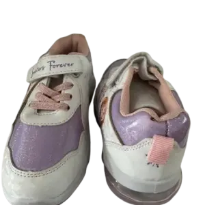 White and purple children's sneakers feature pink laces and hook-and-loop straps labeled "Sisters Forever