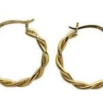 Twisted gold hoop earrings.